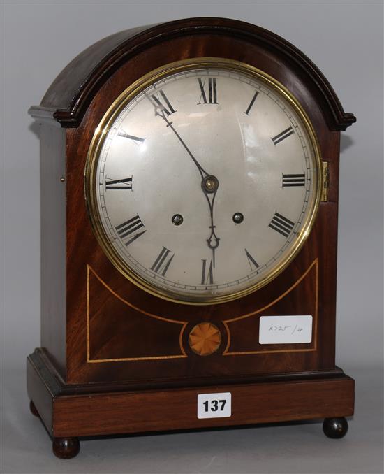 An Edwardian inlaid mahogany eight day mantel clock